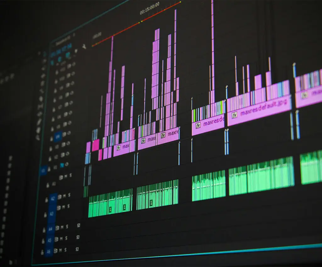 Close-up of a video editing timeline on a screen, resembling the Premiere Pro software used for post-production editing.